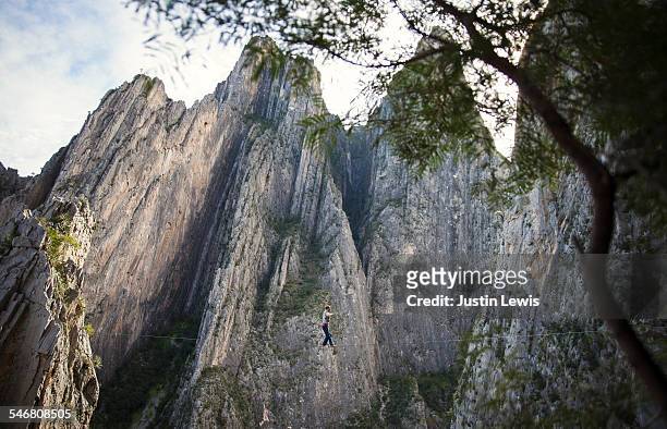 man on tightrope over canyon - nuevo leon state stock pictures, royalty-free photos & images