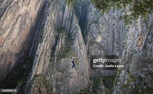 man balanced on line above canyon - wonderlust2015 stock pictures, royalty-free photos & images