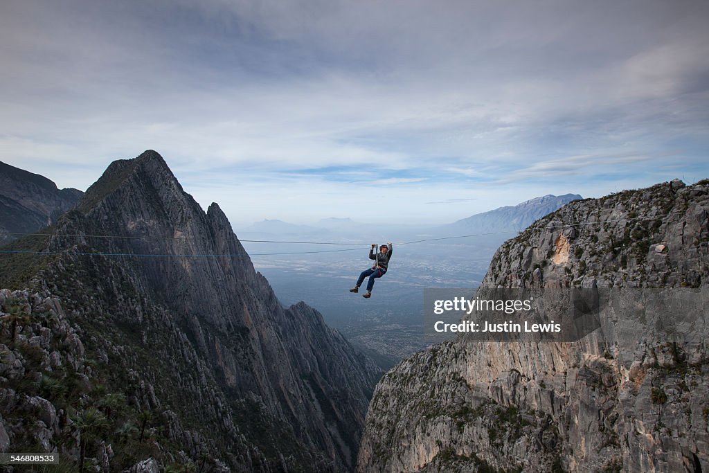 Man Zip Lines Across Canyon