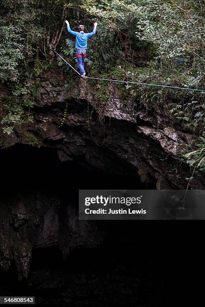 man alone on rope over abyss - wonderlust2015 stock pictures, royalty-free photos & images