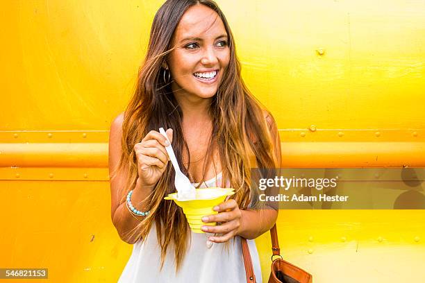 caucasian woman eating shaved ice - shaved ice stockfoto's en -beelden