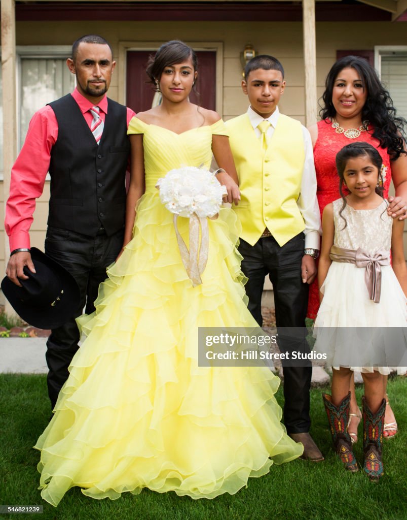 Hispanic family celebrating quinceanera