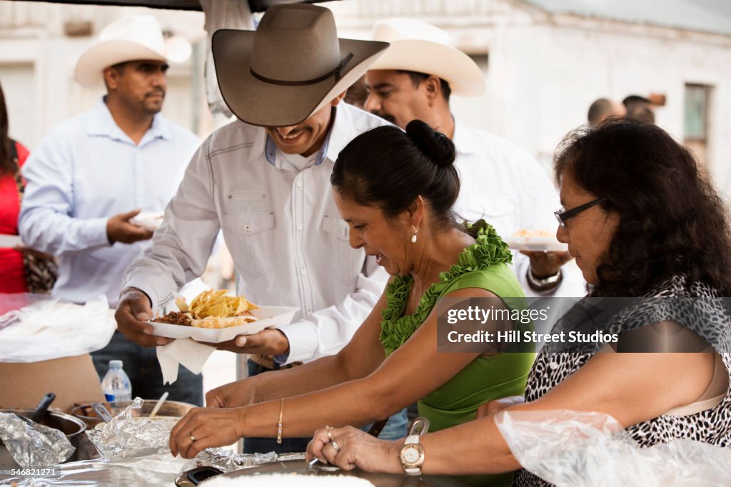 Hispanic community eating at quinceanera