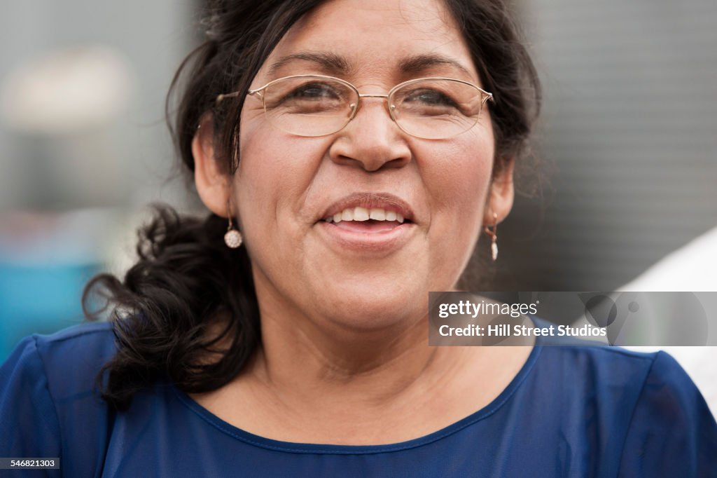 Hispanic woman smiling outdoors