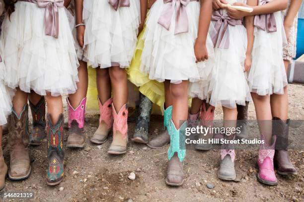 hispanic girls wearing cowboy boots at quinceanera - cowboy boots stock pictures, royalty-free photos & images