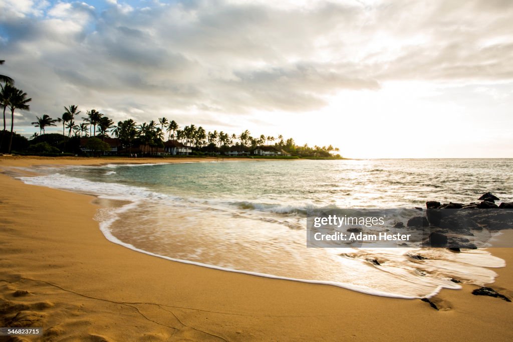 Ocean waves washing up on tropical beach