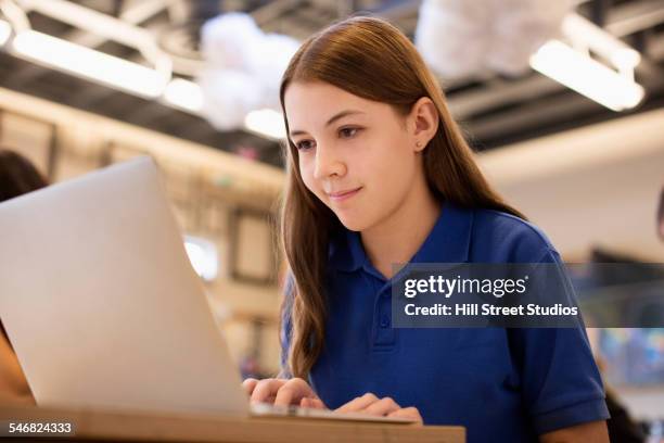 caucasian student using laptop in class - 14 year old brunette girl stock pictures, royalty-free photos & images