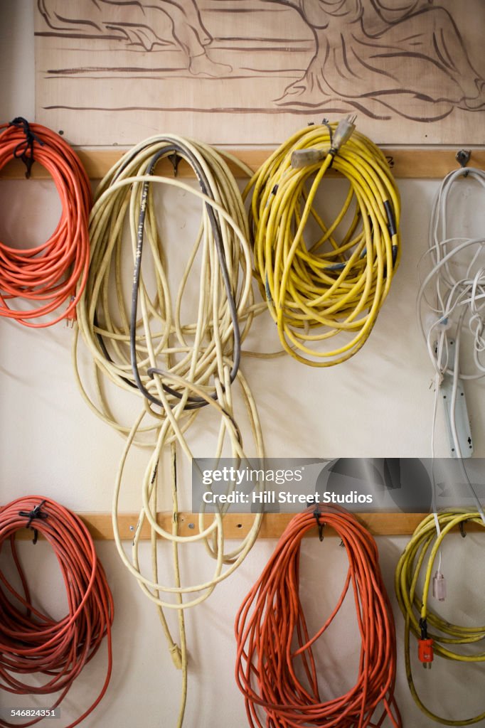 Coils of cord hanging on hooks