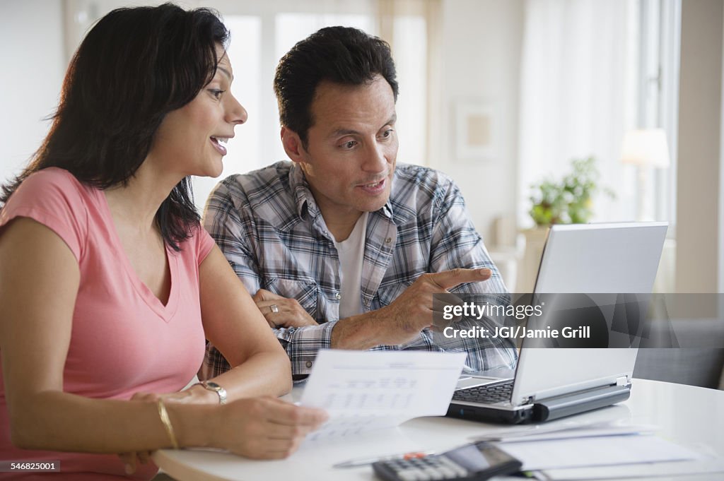 Couple paying bills online