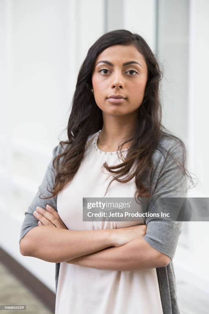 Indian businesswoman standing with arms crossed