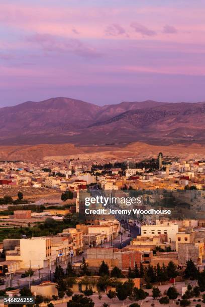 aerial view of midelt cityscape under sunset sky, morocco - midelt photos et images de collection