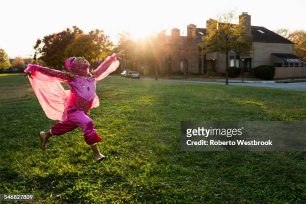 african american girl dancing in princess costume - children dancing outside stockfoto's en -beelden