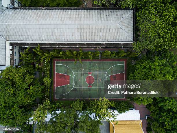 top view of basketball and sport ground surrounded with tree - trefferversuch stock-fotos und bilder