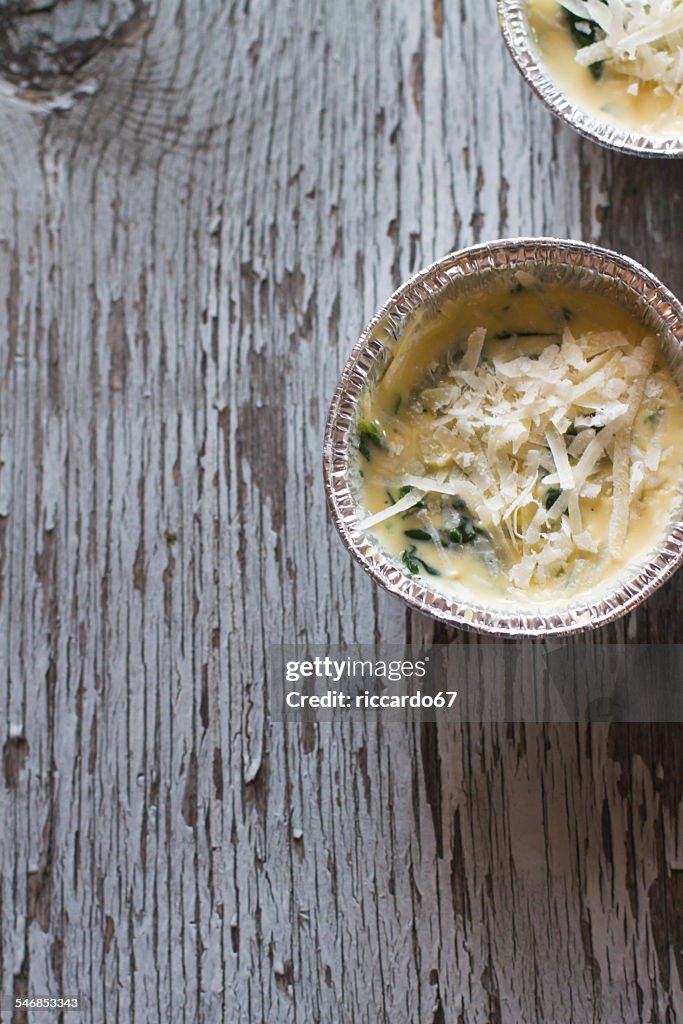 Directly Above Shot Of Casseroles With Eggs And Parmesan Cheese