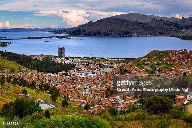 view of puno and lake titicaca, puno, peru, south america - puno stock pictures, royalty-free photos & images