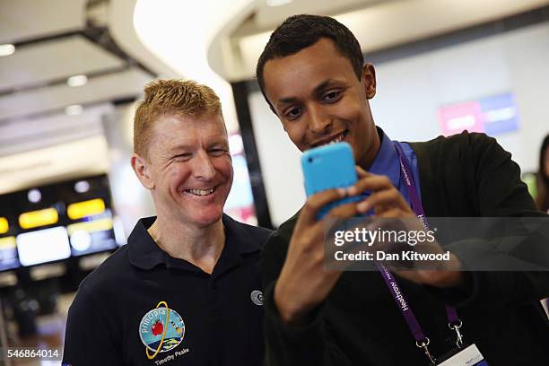 British astronaut Tim Peake has his picture taken with a member of Heathrow Staff after he arrived at Heathrow Airport on a flight from Houston on...