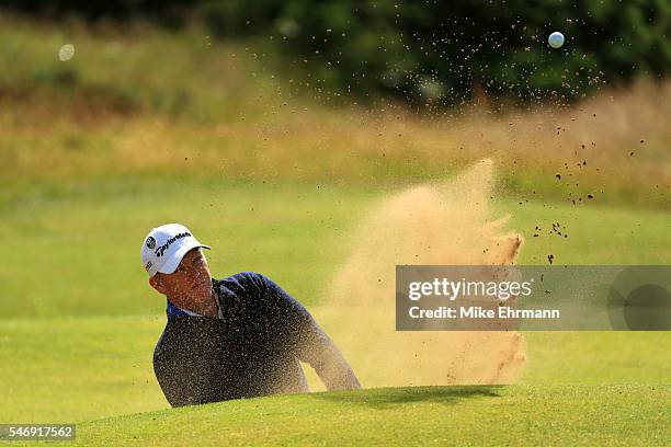 Scott Hend of Australia plays a shot from a bunker on the 14th hole during a practice round ahead of the 145th Open Championship at Royal Troon on...