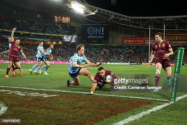 Greg Inglis of the Maroons scores a try during game three of the State Of Origin series between the New South Wales Blues and the Queensland Maroons...
