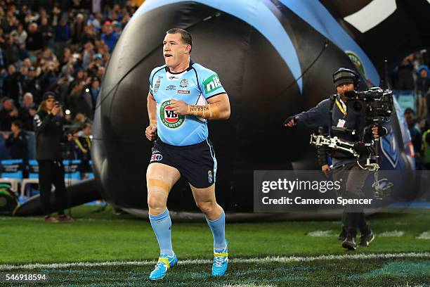 Paul Gallen of the Blues runs onto the field to play in his last State of Origin match before game three of the State Of Origin series between the...