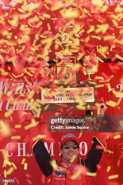 Jeff Gordon celebrates winning the championship at the NASCAR Winston Cup NAPA 500 at the Atlanta Motor Speedway in Hampton, Georgia. Digital Image....