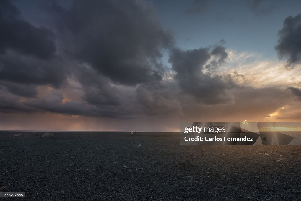 People walking on a rocky plain in Iceland