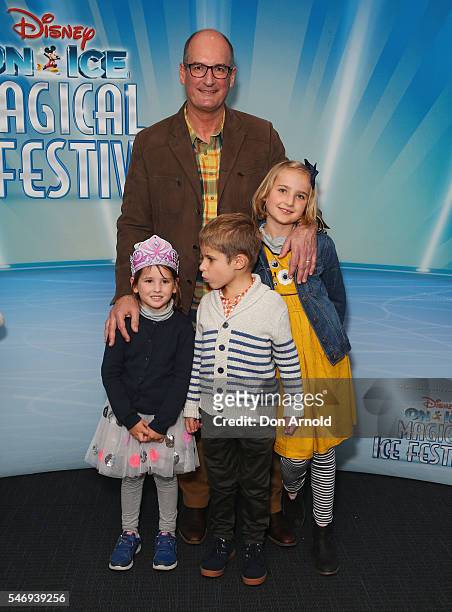 David Koch poses with his grand children Lila Brown, Oscar Brown and Matilda Brown ahead of the Disney On Ice premiere at Qudos Bank Arena on July...