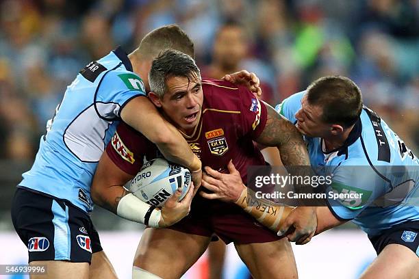 Corey Parker of the Maroons is tackled during game three of the State Of Origin series between the New South Wales Blues and the Queensland Maroons...