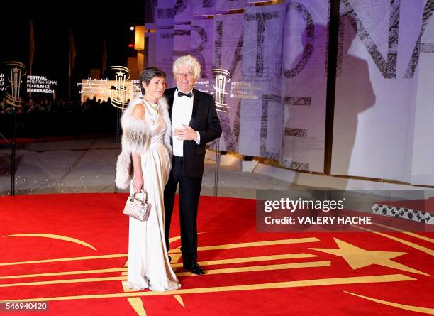 French director Jean Jacques Annaud and his wife Laurence Duval-Annaud arrives for the opening ceremony of the Marrakech 11th International Film...