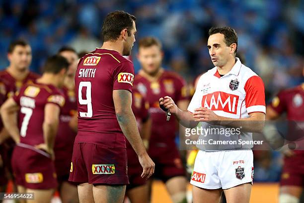 Cameron Smith of the Maroons talks to match referee Gerard Sutton during game three of the State Of Origin series between the New South Wales Blues...