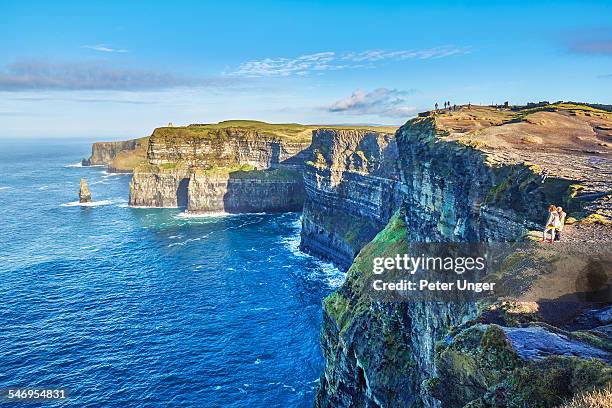 cliffs of moher, county clare - beautiful irish person stockfoto's en -beelden