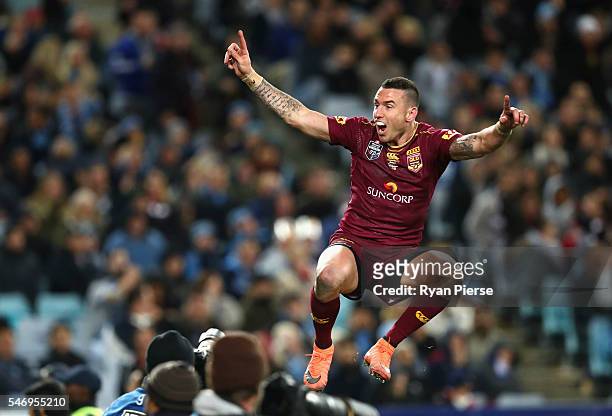 Darius Boyd of the Maroons celebrates after scoring a try during game three of the State Of Origin series between the New South Wales Blues and the...