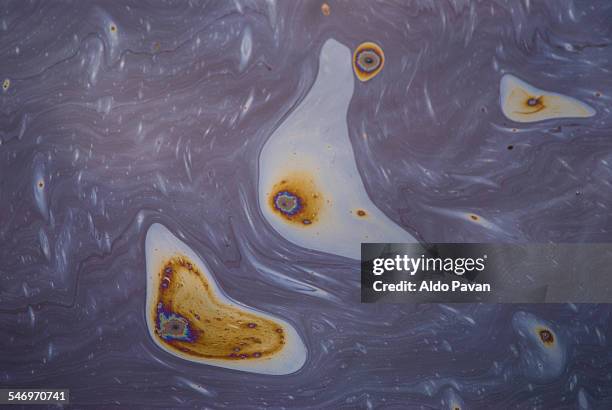 petroleum plants, colored oil spill - oil slick stock pictures, royalty-free photos & images