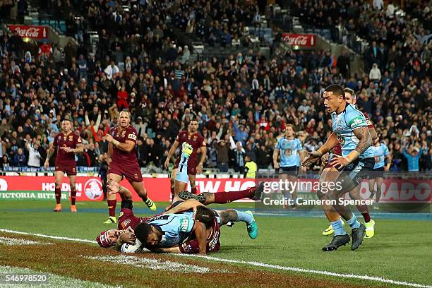 Michael Jennings of the Blues scores the winning try during game three of the State Of Origin series between the New South Wales Blues and the...