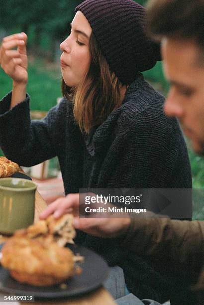 an apple orchard in utah. a couple eating, food and drink on a table. - man eating pie stock pictures, royalty-free photos & images