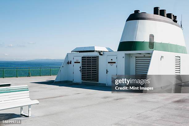 the empty top deck of a commercial ferry boat off the coast of seattle, washington.  - seattle ferry stock pictures, royalty-free photos & images
