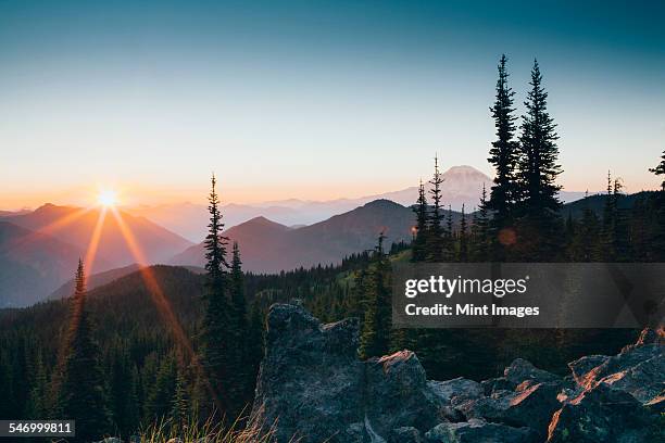 sunset over the cascade range of mountains at goat rocks wilderness. - washington state stock pictures, royalty-free photos & images