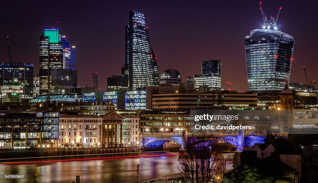 UK, England, London, Illuminated riverfront skyline with skyscrapers