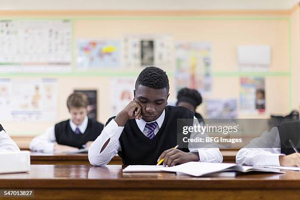 students writing exams in the classroom, cape town, south africa - confused writing ストックフォトと画像