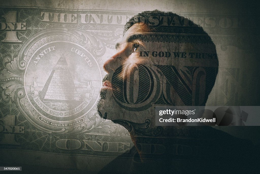 Double exposure of a man looking up and a one dollar bill