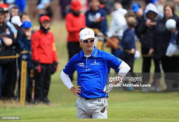 Zach Johnson of the United States looks on from a bunker on the 16th during a practice round ahead of the 145th Open Championship at Royal Troon on...