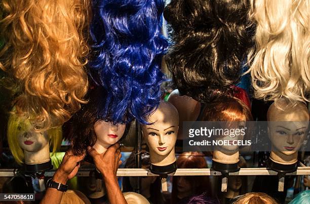 Vendor arranges mannequin's head at Divisoria market in Manila on July 13, 2016. The Philippines' economy grew a better-than-expected 6.9 percent in...