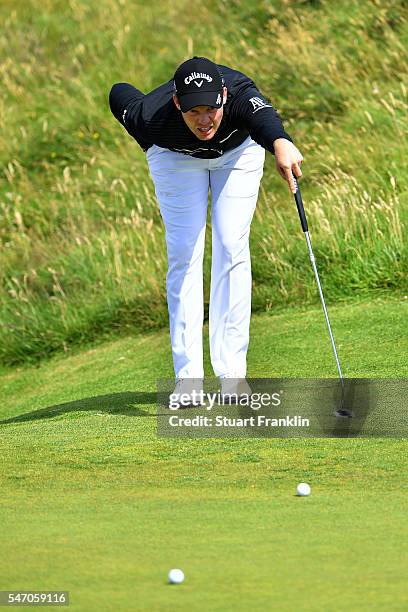 Danny Willett of England lines up a putt during a practice round ahead of the 145th Open Championship at Royal Troon on July 13, 2016 in Troon,...