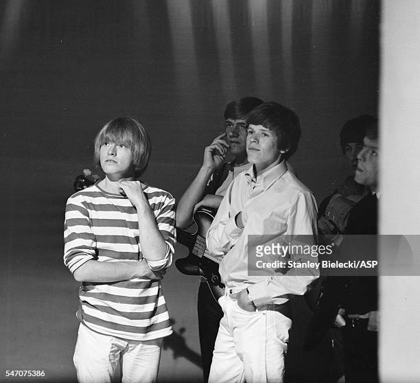 Brian Jones of the Rolling Stones with Karl Green and Peter Noone of Herman's Hermits, backstage Top Of The Pops TV show, London, 1965.