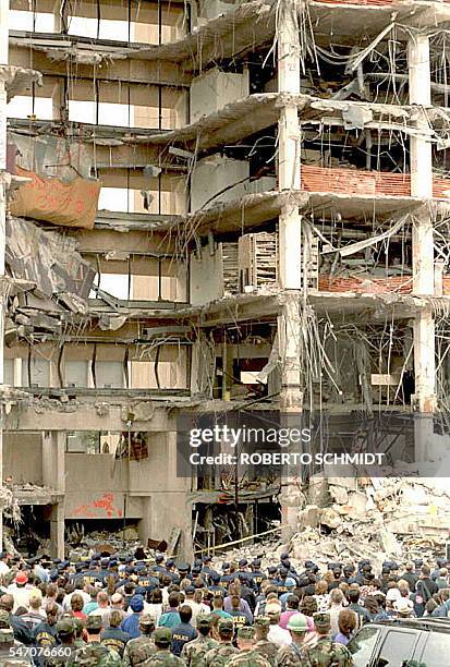 This 05 May, 1995 file photo shows rescue crews and agents from several federal agencies standing in front of the remains of the Alfred P. Murrah...