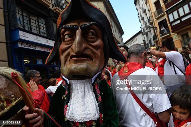 Cabezudo walks between people during the San Fermin Festival in Pamplona, northern Spain, on July 13, 2016. The festival is a symbol of Spanish...