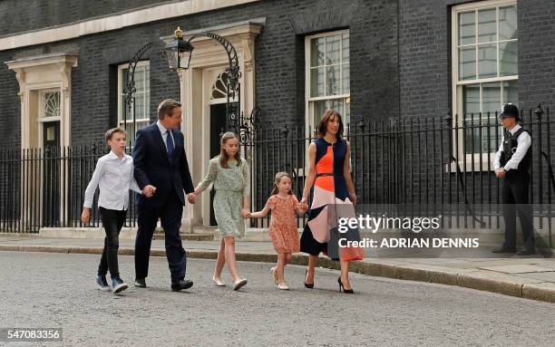 Outgoing British prime minister David Cameron leaves after speaking outside 10 Downing Street with his family son Arthur Elwen, his daughter Nancy...