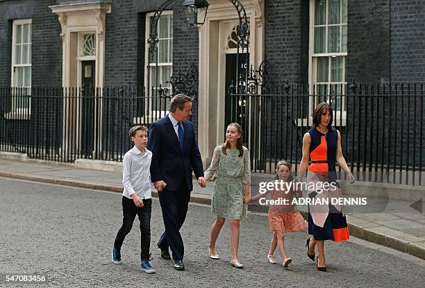 Outgoing British prime minister David Cameron leaves after speaking outside 10 Downing Street with his family son Arthur Elwen, his daughter Nancy...