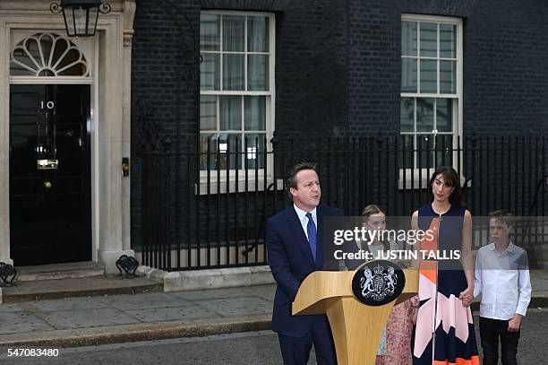 Outgoing British prime minister David Cameron speaks outside 10 Downing Street beside his daughter Nancy Gwen, daughter Florence Rose Endellion , his...