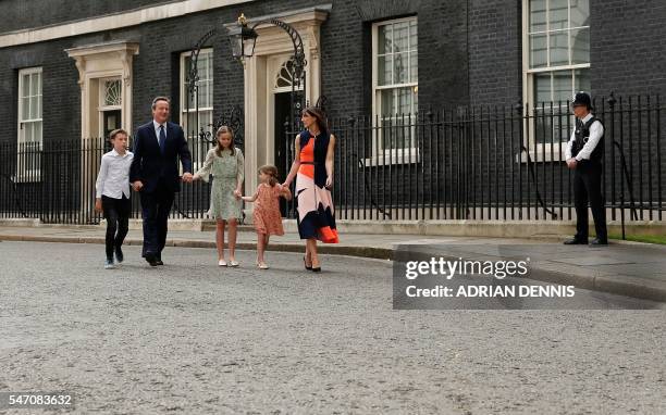 Outgoing British prime minister David Cameron leaves after speaking outside 10 Downing Street with his family son Arthur Elwen, his daughter Nancy...