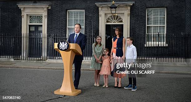 Outgoing British prime minister David Cameron speaks beside his daughter Nancy Gwen, daughter Florence Rose Endellion, his wife Samantha Cameron and...